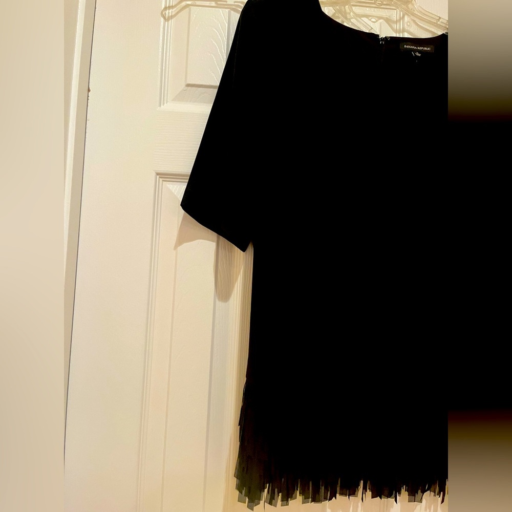 Beautiful black straight top with bottom fringes